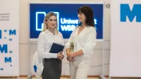 Who we are | WSB Merito Bydgoszcz University: Two female students in a university corridor