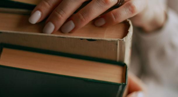 books hand arms libary reading