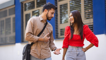 Admissions process stages | WSB Merito Łódź University: A student couple talking outdoors