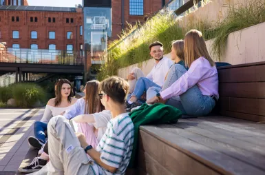 Study in Łódź | WSB Merito Łódź University: Students sitting on stairs