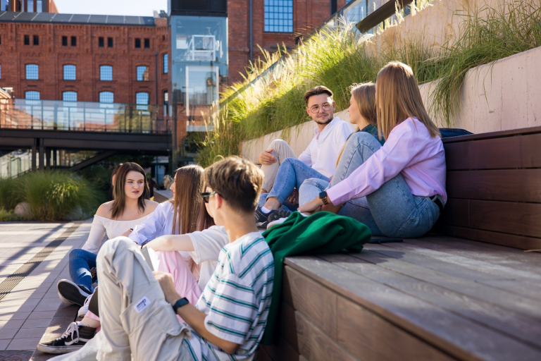 Study in Łódź | WSB Merito Łódź University: Students sitting on stairs