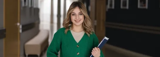 Language certificates | WSB Merito Toruń University: A student in green dress