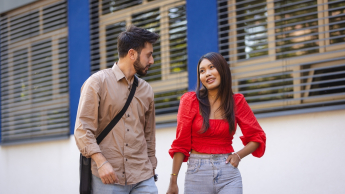 Admissions process stages | WSB Merito Warsaw University: Two students talking outdoor