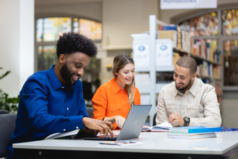 Department of International Relations | WSB Merito Wrocław University: A group of students in a library